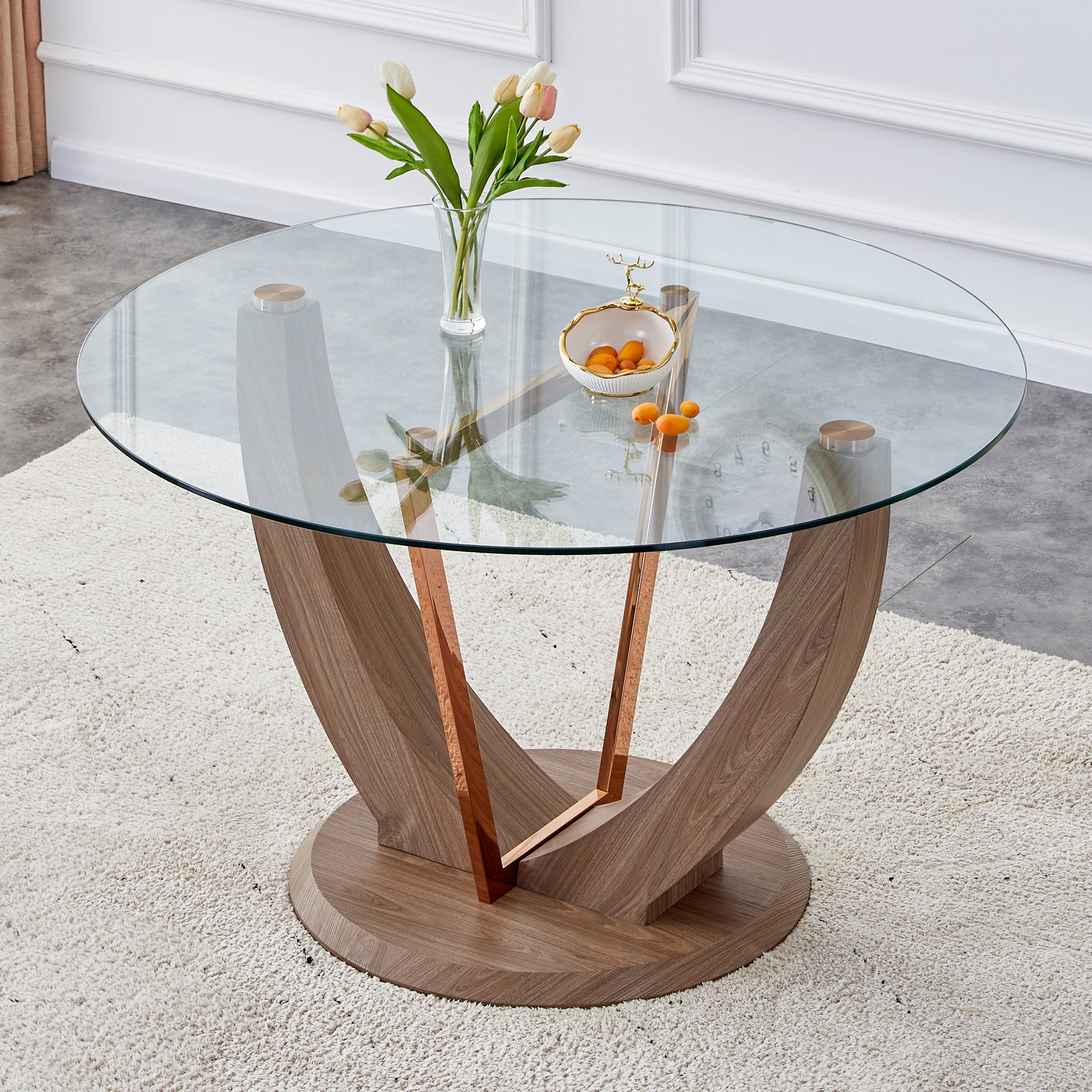 A modern minimalist circular tempered glass dining transparent-glass